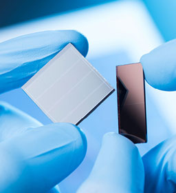 Solar cells in a lab with gloves